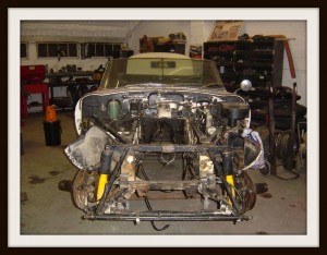 E Type Jaguar being stripped for re paint